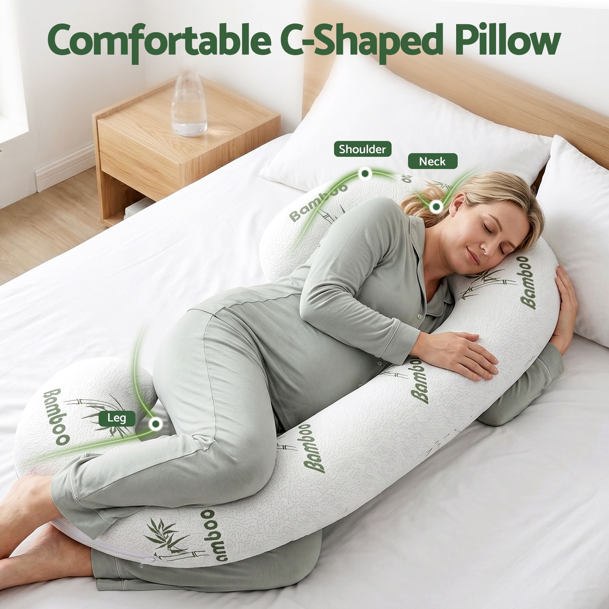 C-shaped maternity body pillow with white bamboo-fiber cover and green bamboo pattern