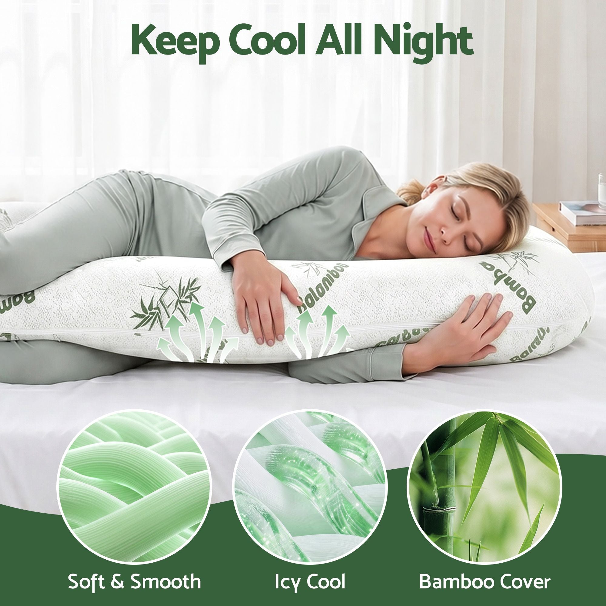 C-shaped maternity body pillow in white with green bamboo print, shown in side-lying