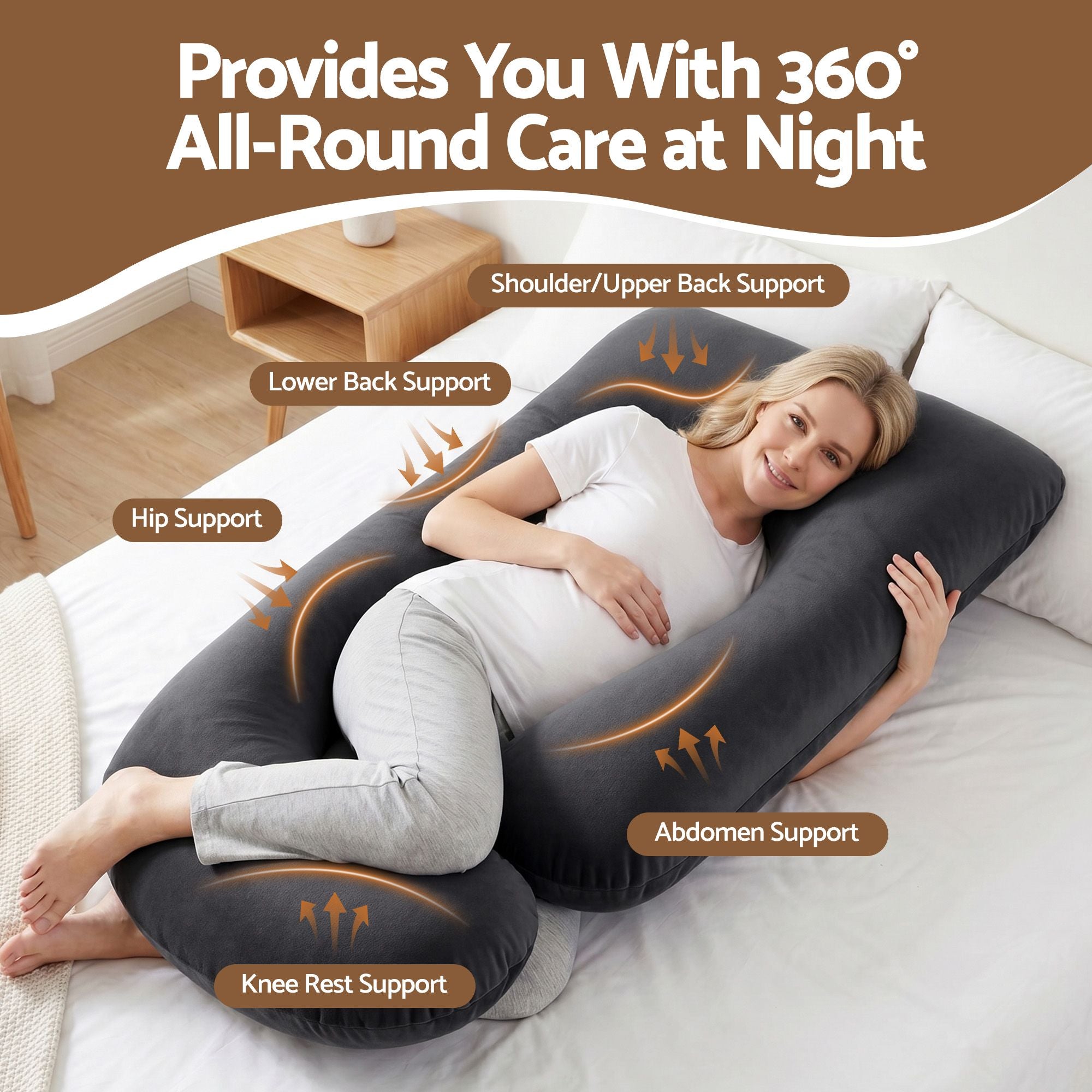 Dark grey G-shaped pregnancy pillow showing mapped support zones on the body