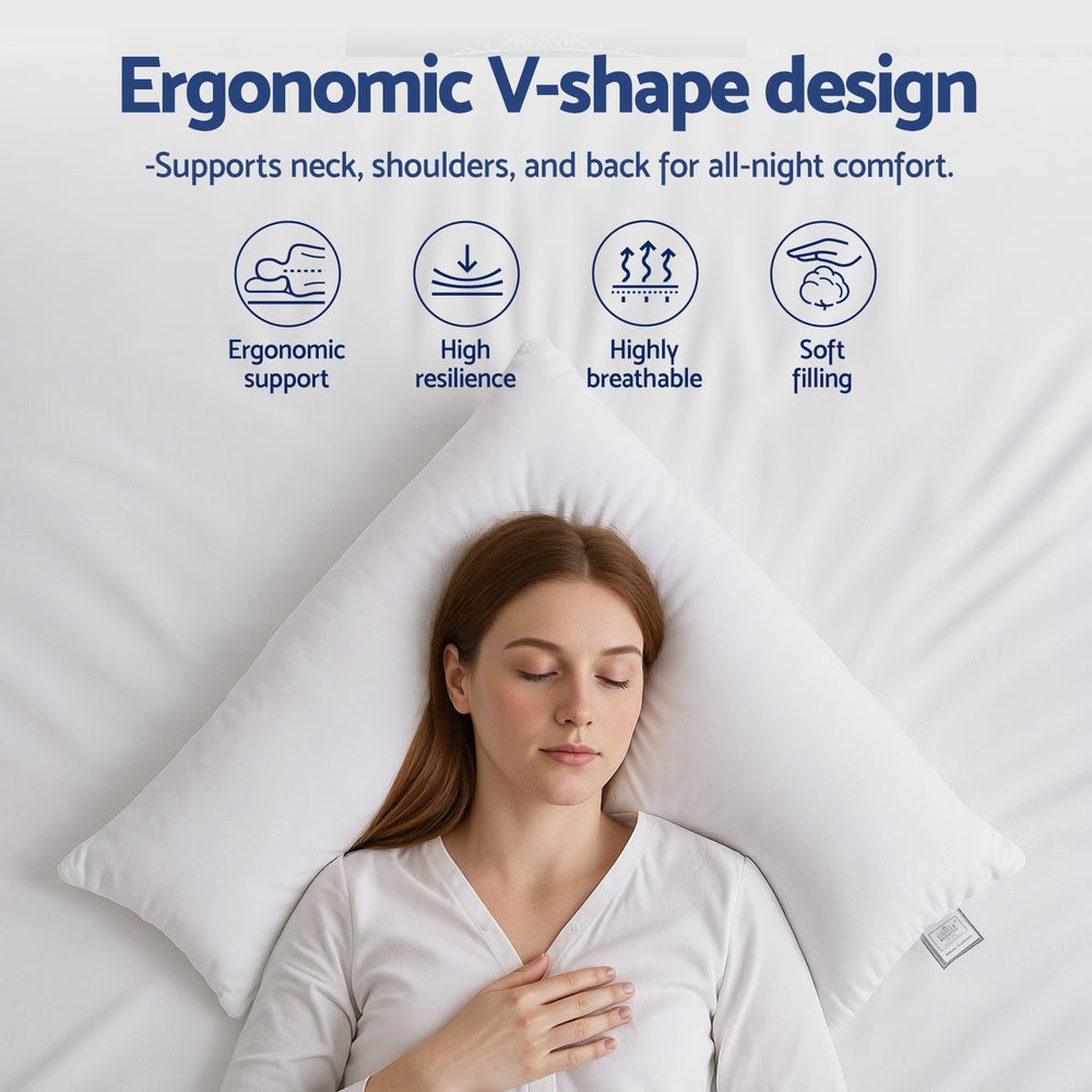 White V-shaped nursing body cushion supporting a sleeper's upper body.
