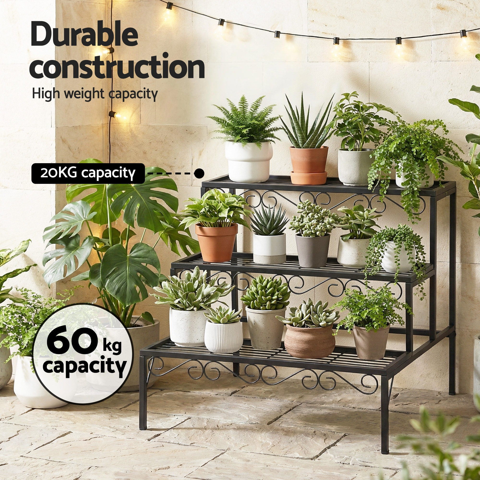 Black 3-tier metal plant shelf with scrollwork, holding many potted plants