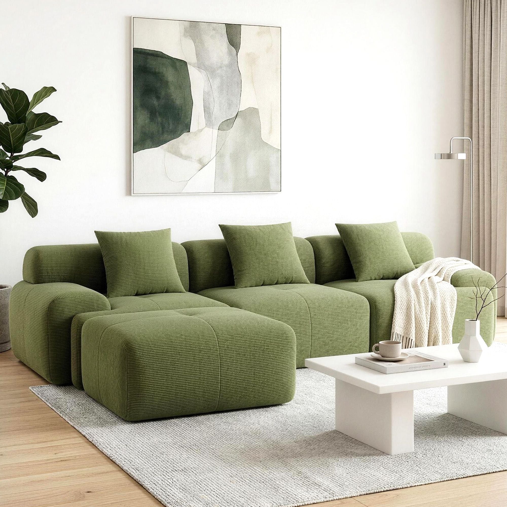 Green modular L-shaped sectional sofa bed with chaise and back cushions