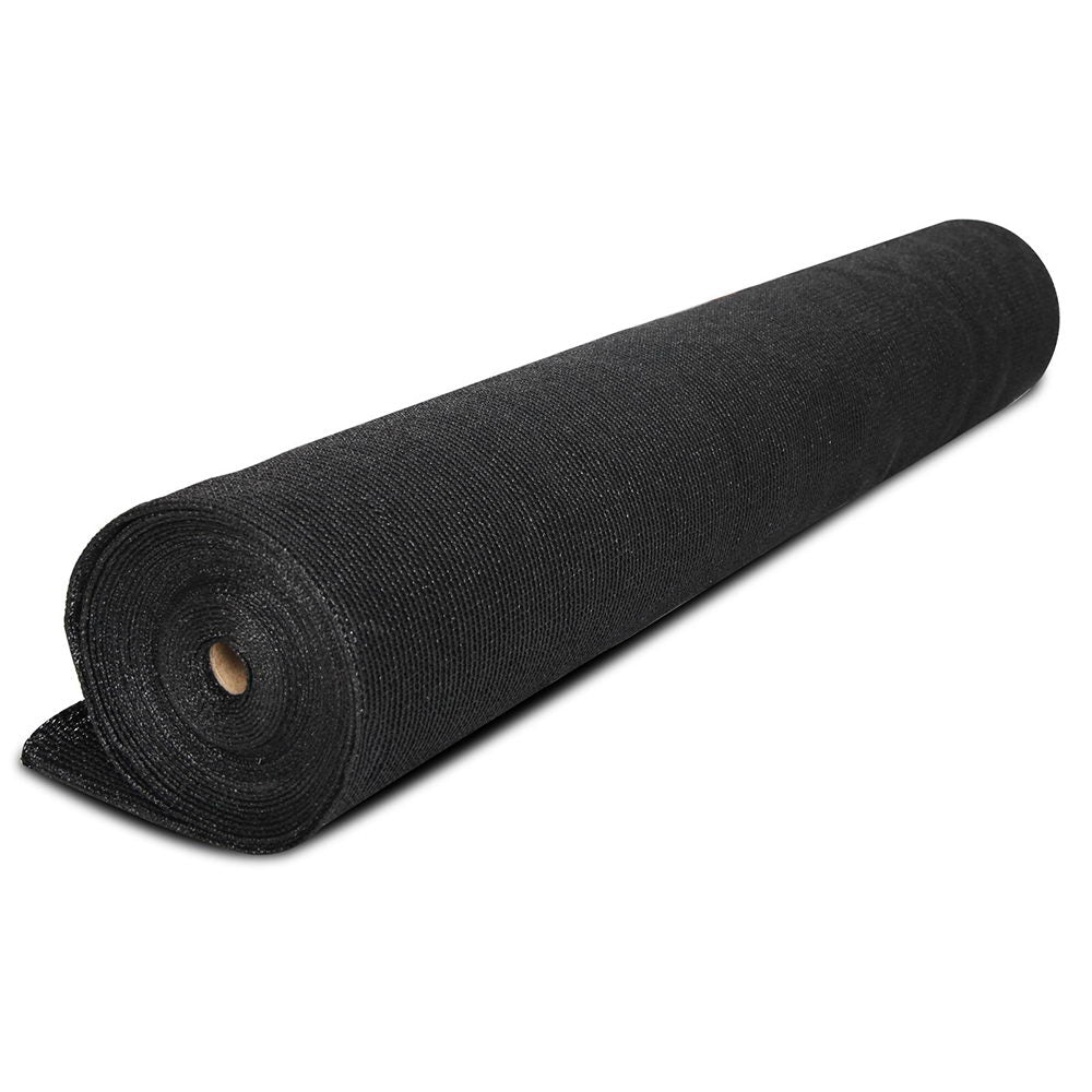 Black shade cloth roll with visible core and tightly wound woven texture