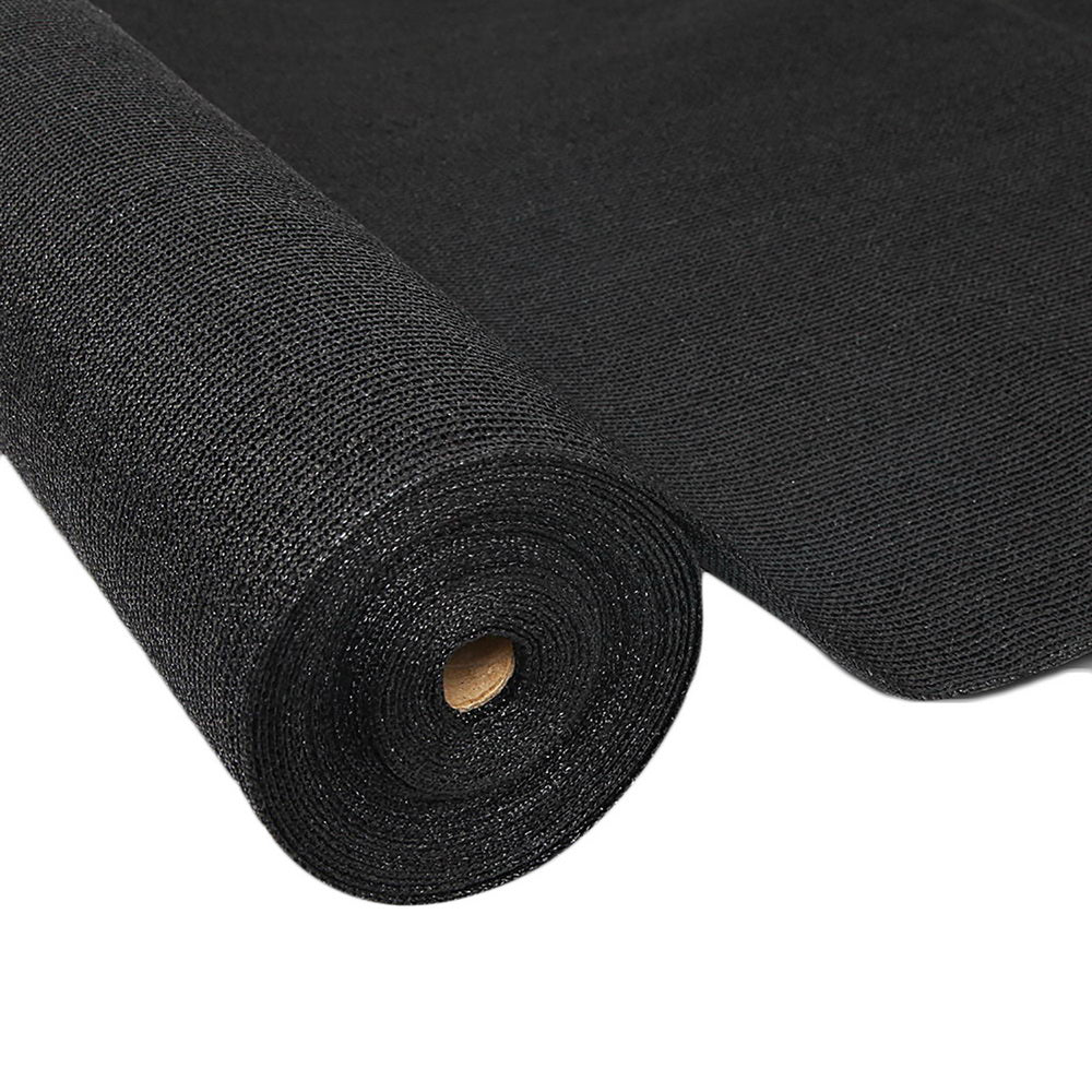 Black shade cloth roll with woven mesh texture and inner core on white