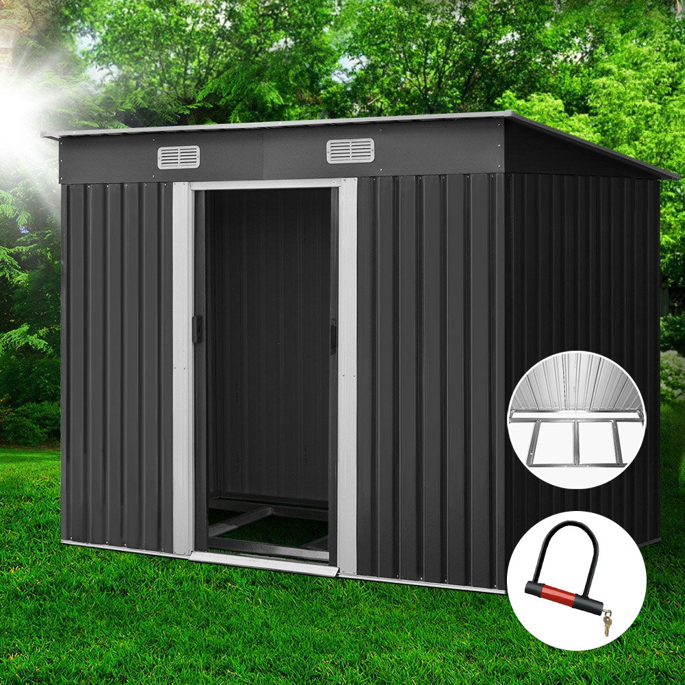 Outdoor metal storage shed, dark gray with vent panels and open single door