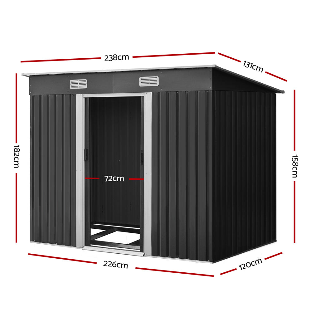 Dimensions diagram of dark gray outdoor storage shed with open door and flat roof