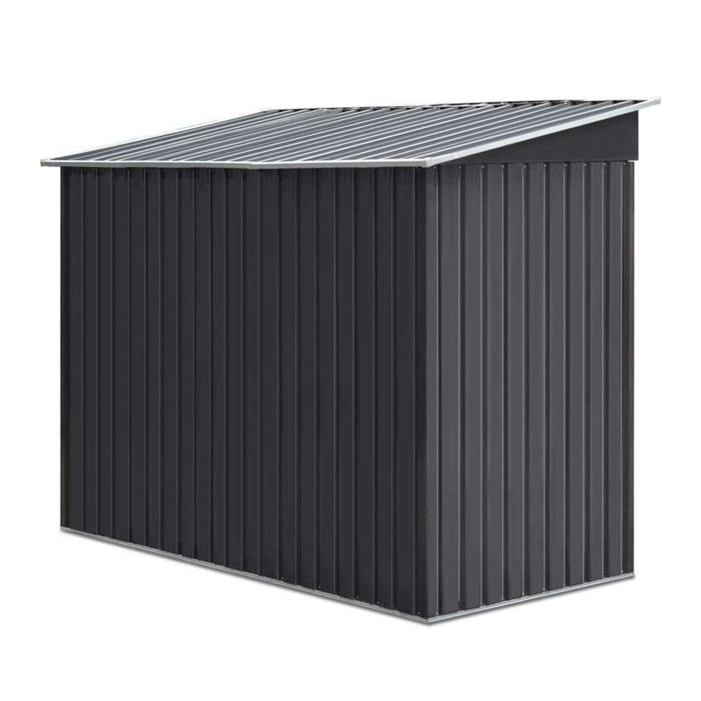 Outdoor metal storage shed, dark gray ridged wall panels with sloped roof
