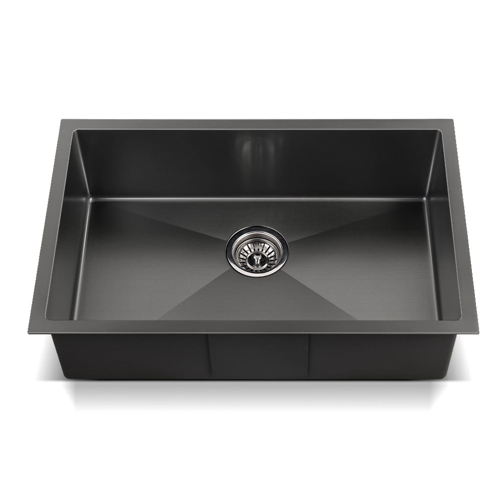 Black single-bowl kitchen sink with centered round drain and smooth interior