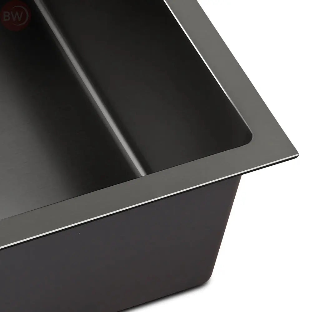 Black stainless kitchen sink showing sloped interior and side rim detail