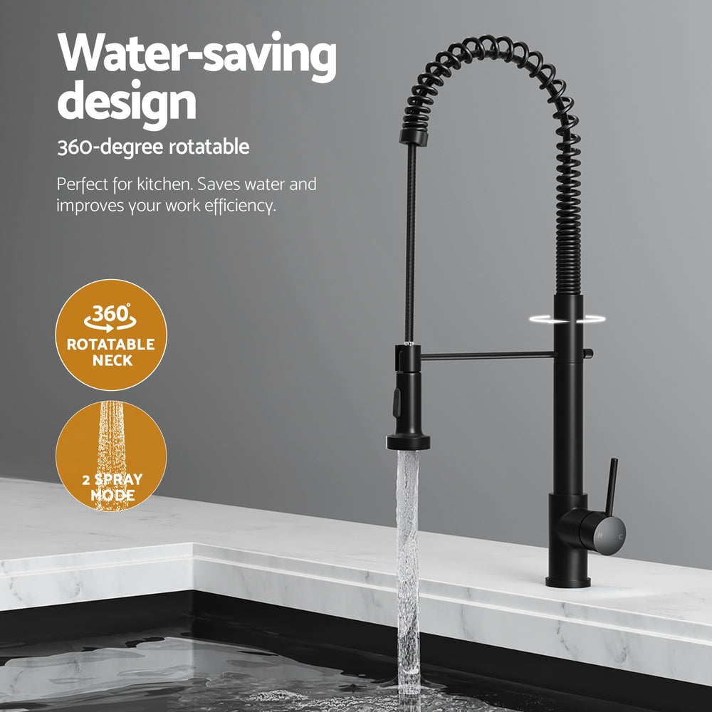 Black pull-out kitchen mixer tap with water stream over a sink basin