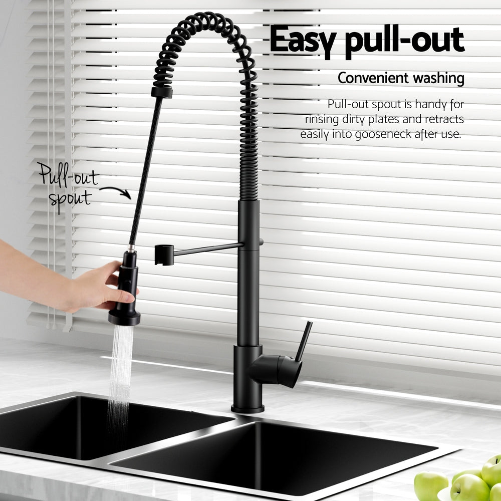 Black pull-out tap with retracting spout, shown dispensing water over sink