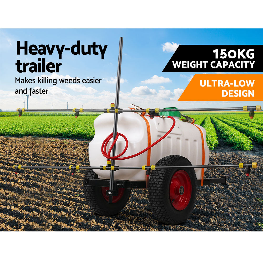 Weed sprayer trailer with white tank, red wheel, and extended boom on trailer frame