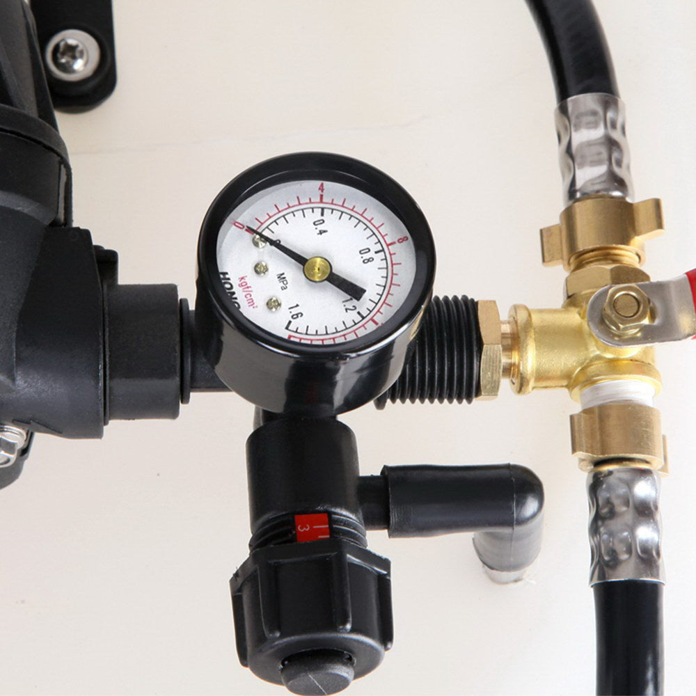 Weed sprayer pressure gauge with brass valves and connected hoses
