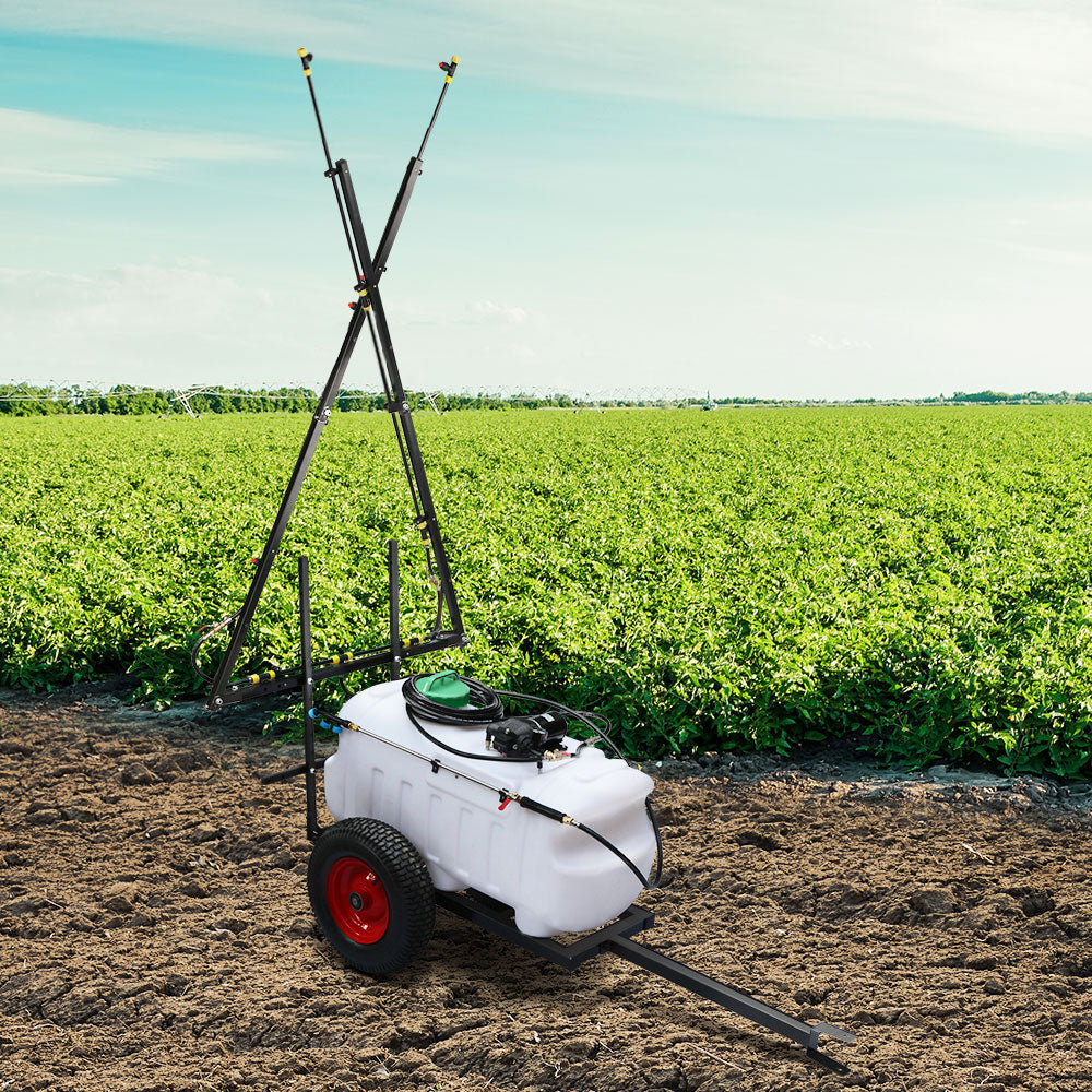 Trailer weed sprayer with white tank, black boom frame, and red wheel