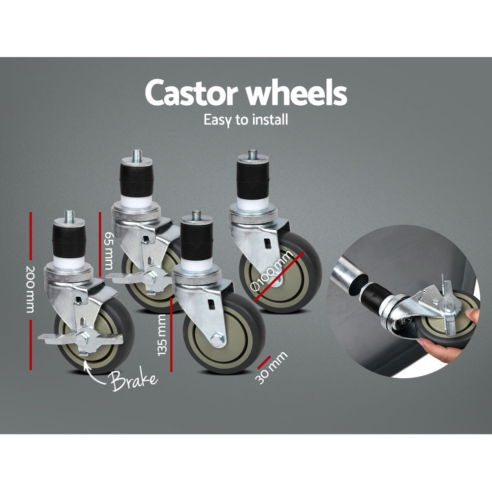 Caster wheels with brake on stainless steel kitchen bench, close-up of wheel assemblies