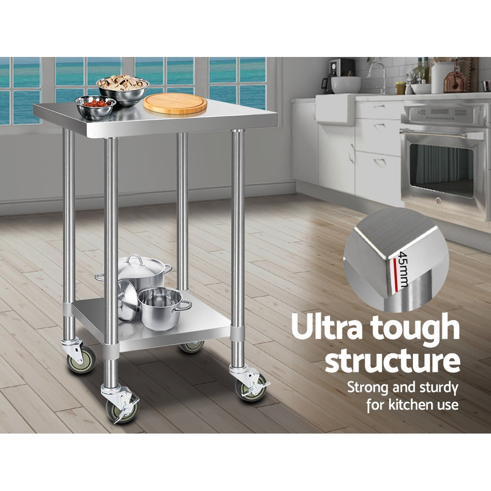 Stainless steel kitchen bench cart with two shelves and rolling caster wheels in kitchen