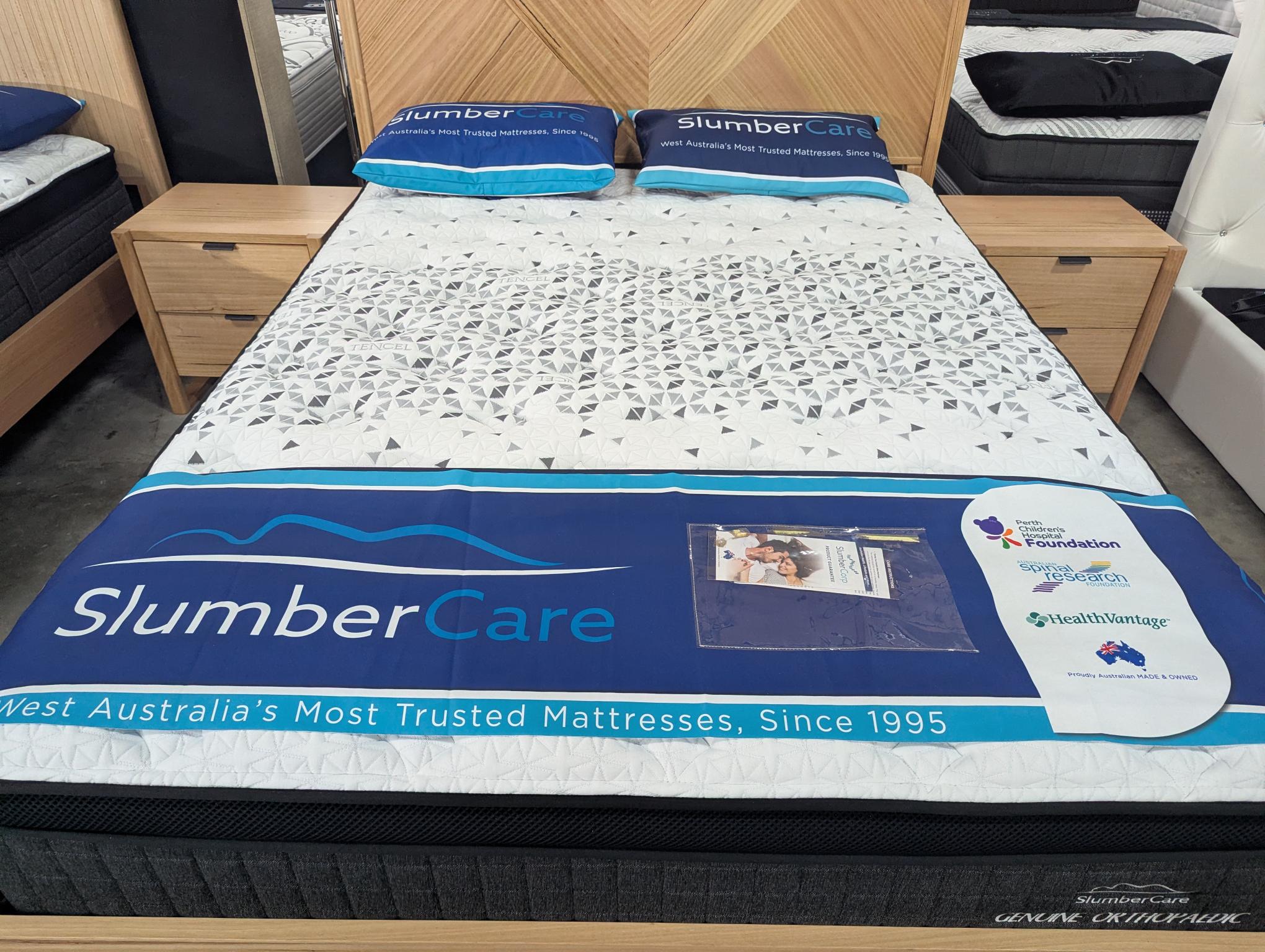 Mattress with SlumberCare branding in a bedroom setting
