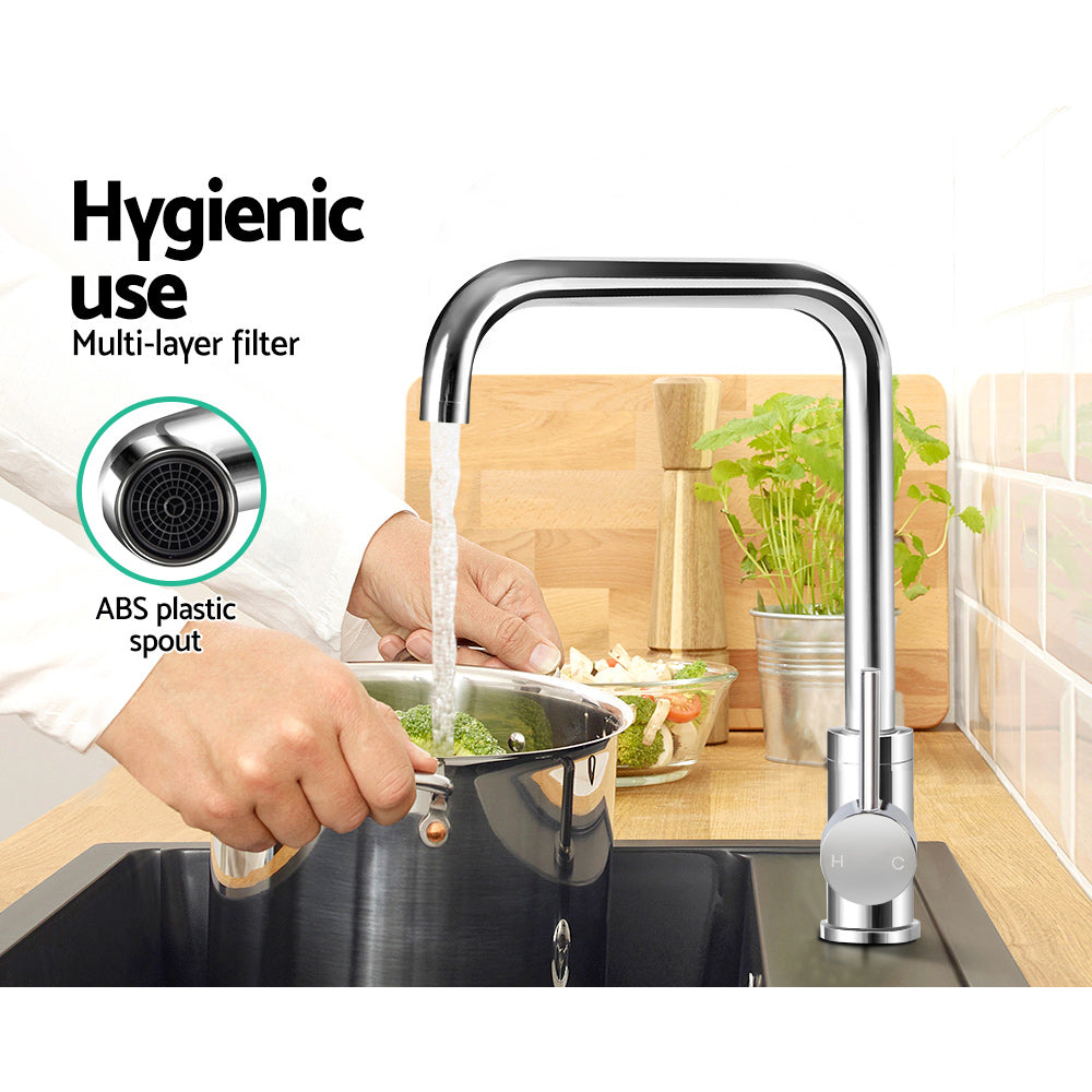 Chrome kitchen mixer tap with tall spout and single lever, spray filter head.