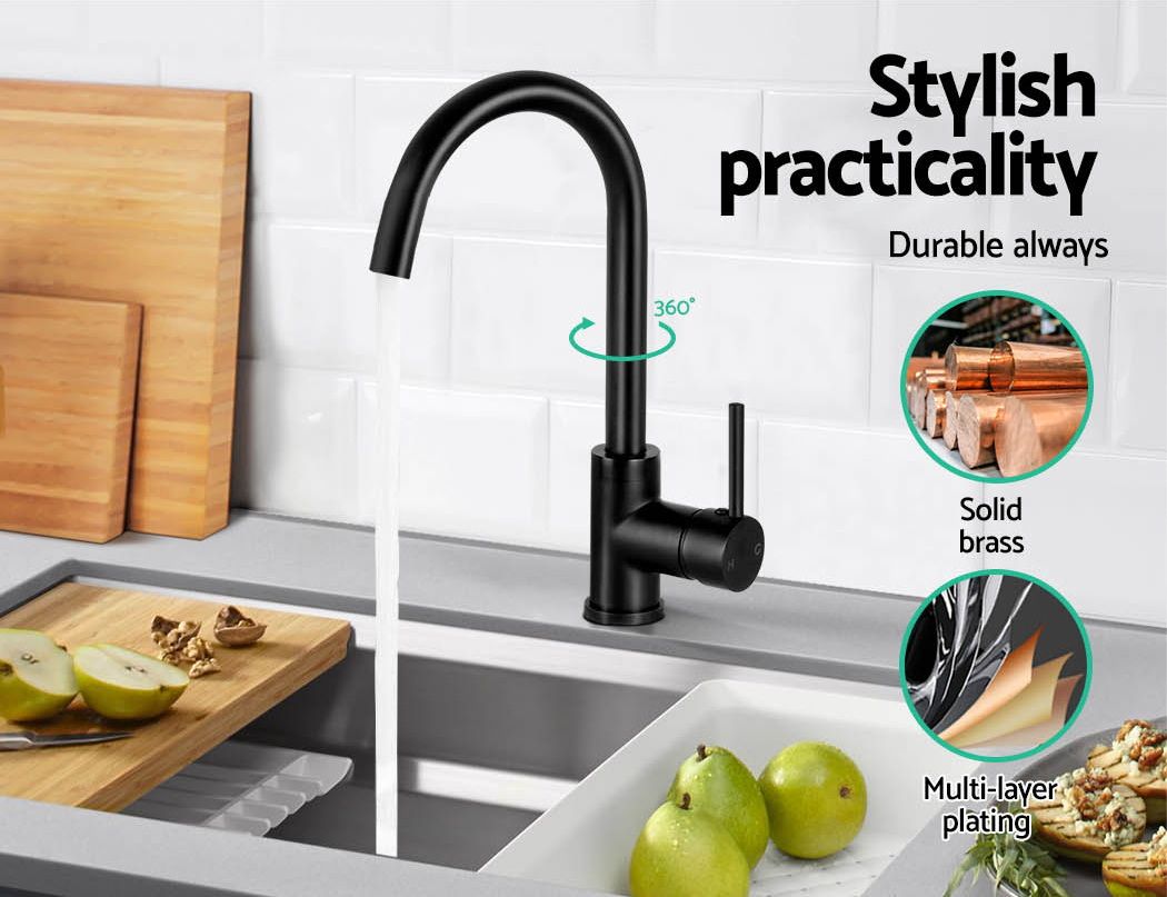 Black kitchen sink mixer tap on counter with arched spout and cylindrical lever