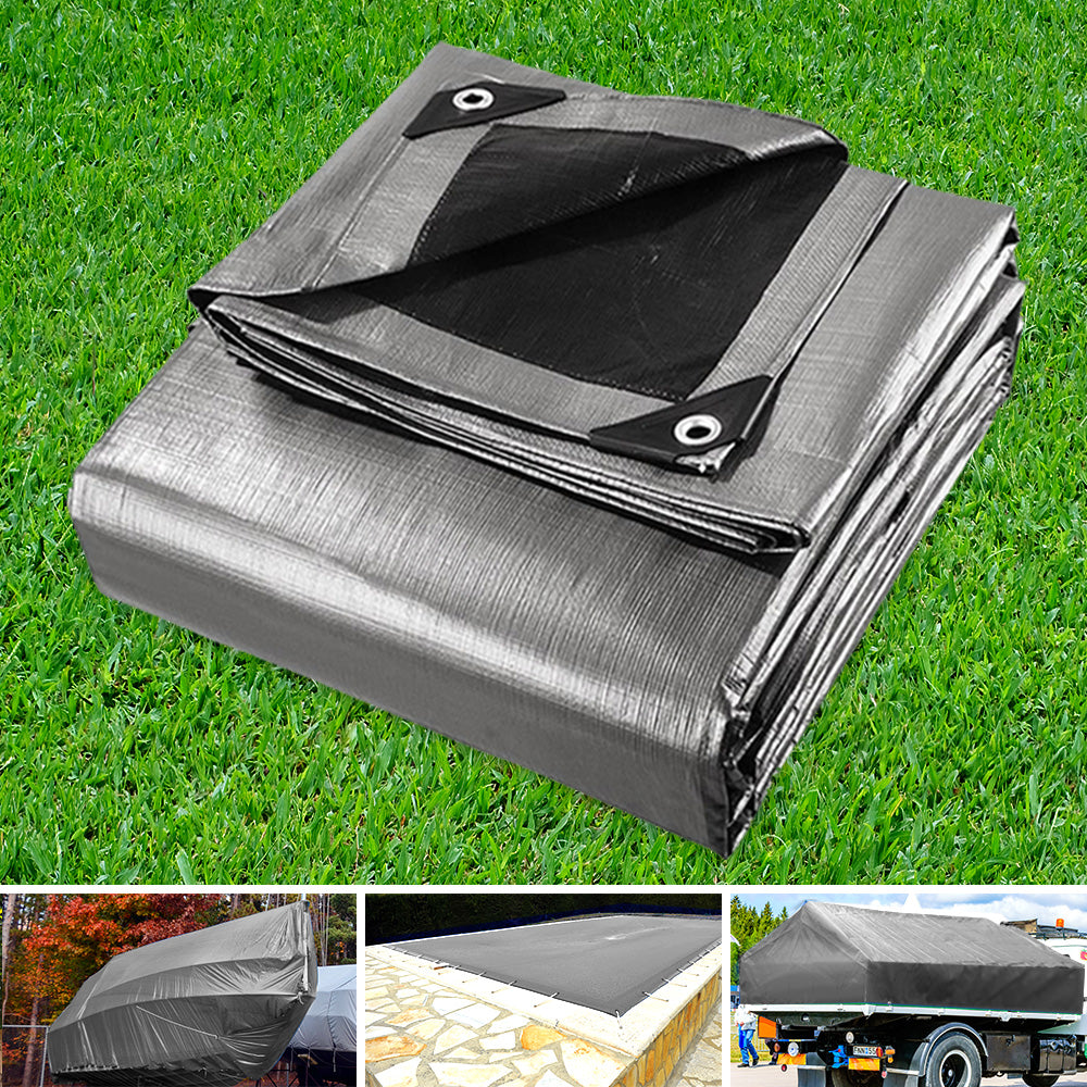 Folded silver-gray canvas tarpaulin with black corner straps and metal grommet tabs
