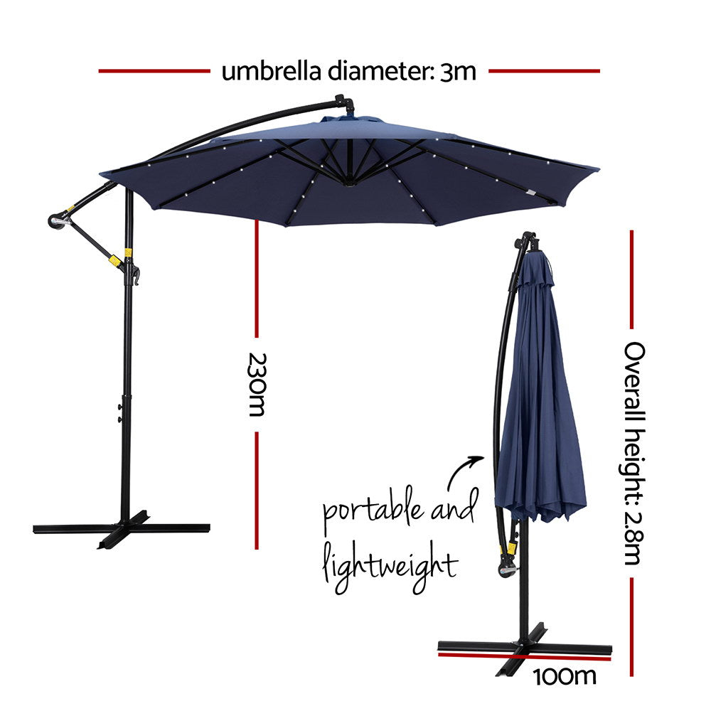 Cantilever outdoor umbrella with navy canopy and hanging cover