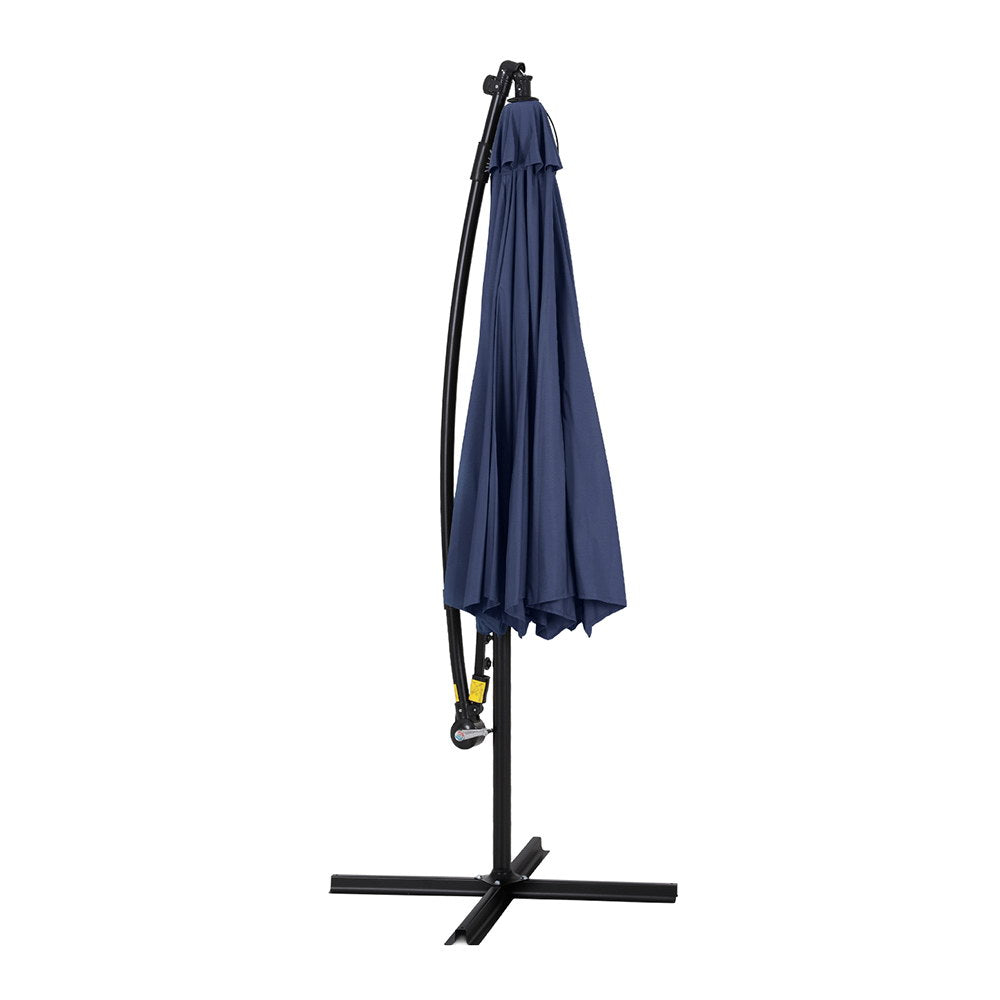 Cantilever umbrella with navy fabric cover hanging from frame