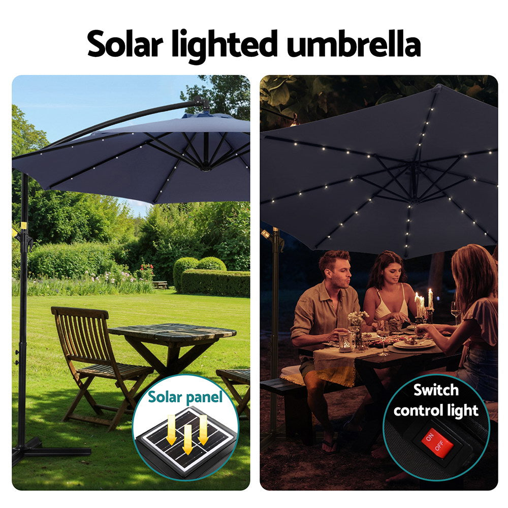 Solar-lit cantilever umbrella canopy with LED string lights