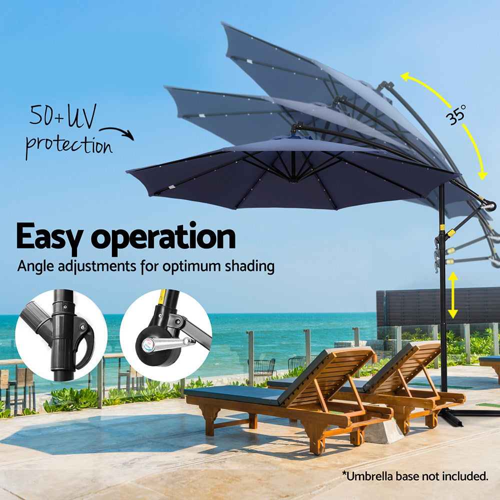 Outdoor cantilever umbrella with navy canopy and adjustable tilt