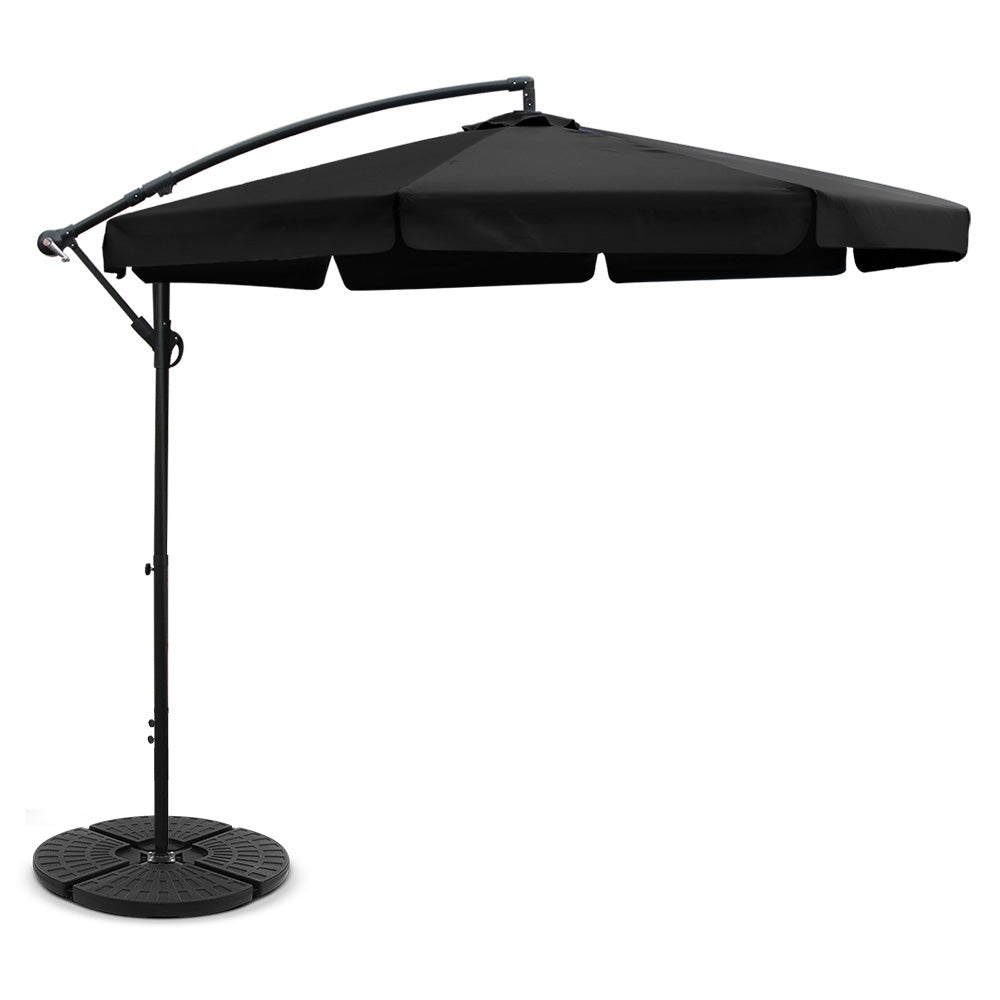 Black cantilever outdoor umbrella with fabric canopy and round weighted base