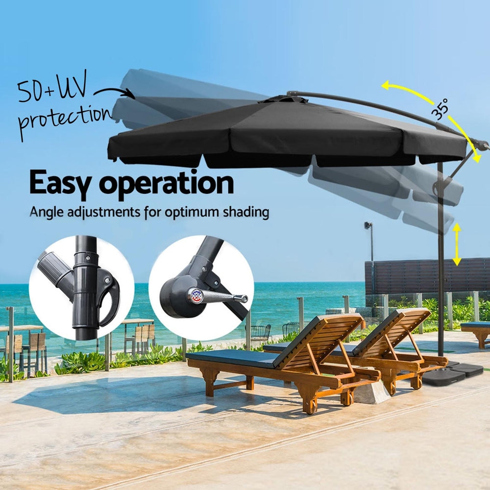 Black cantilever umbrella with extended canopy and adjustable angle arm over seating