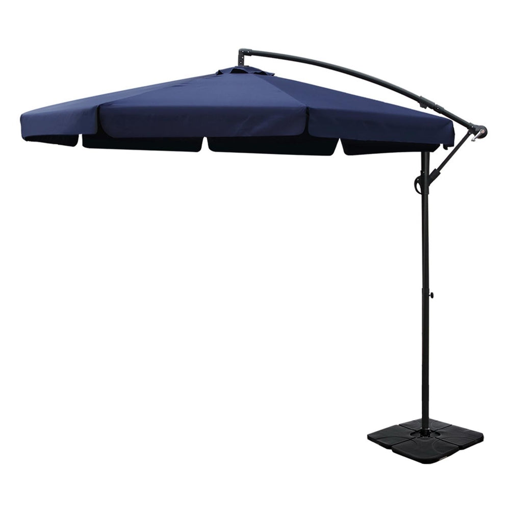 Navy cantilever patio umbrella with arched frame and black square base