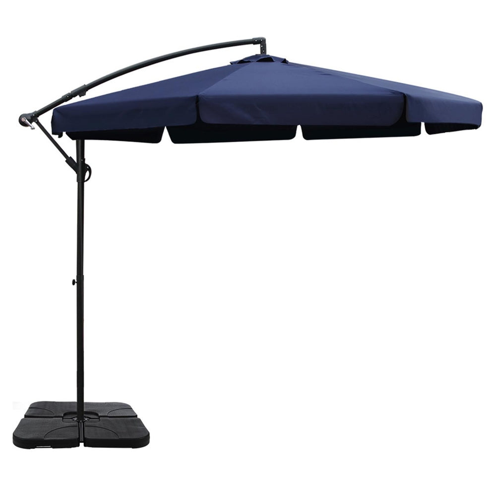 Navy cantilever umbrella with segmented canopy and tall black pole, square base plate