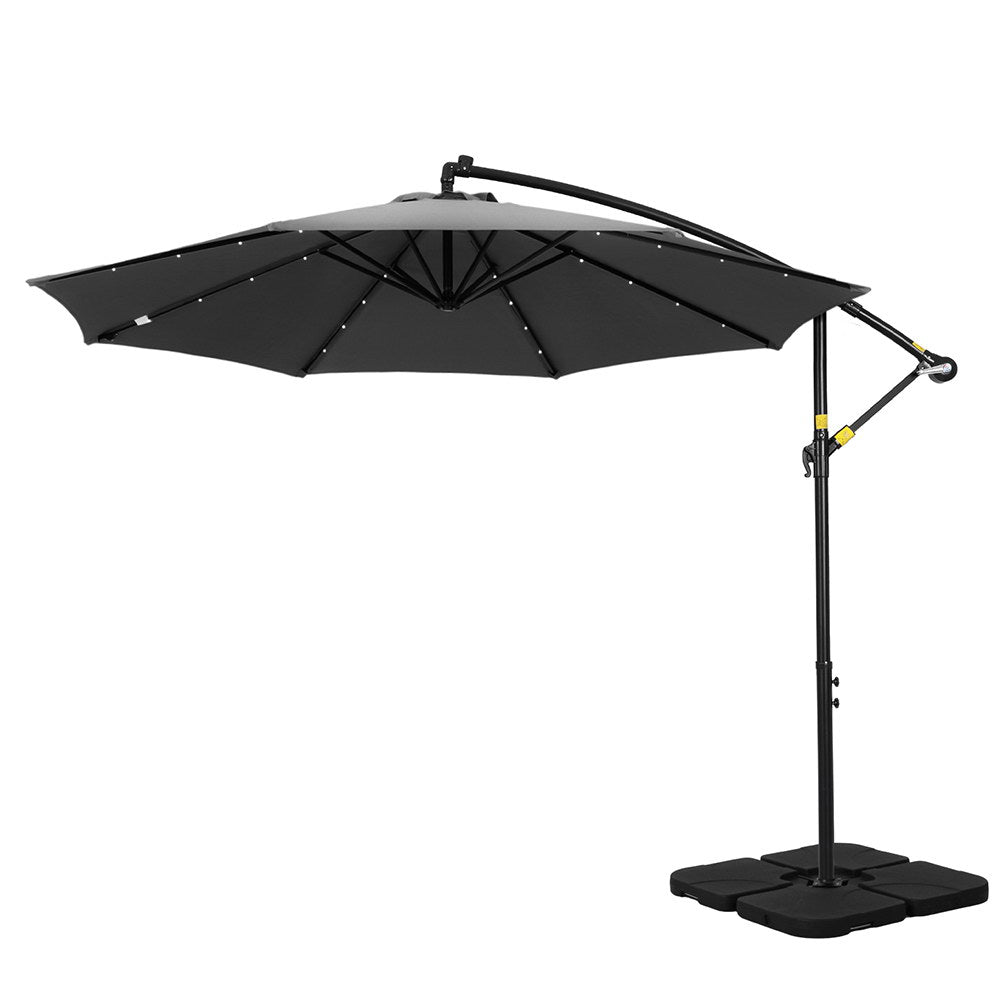 Charcoal cantilever patio umbrella with black canopy and side-mounted pole