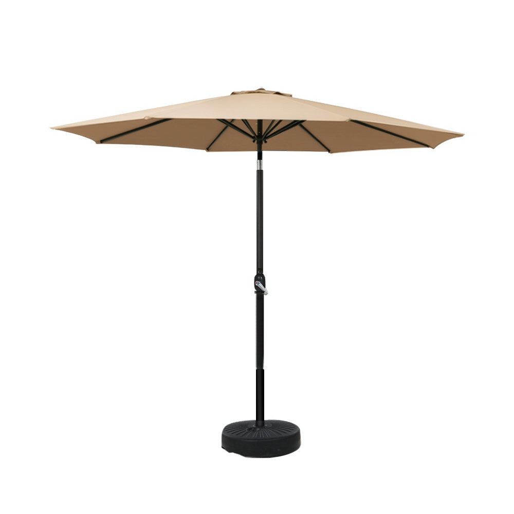 Beige outdoor umbrella with black pole and circular base stand