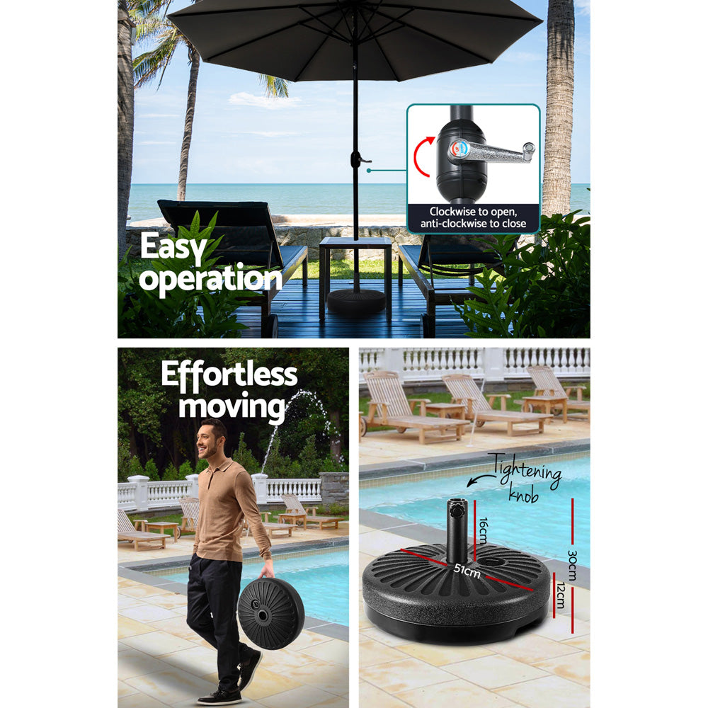 Black outdoor umbrella with tilt canopy and central pole, shown with control hardware