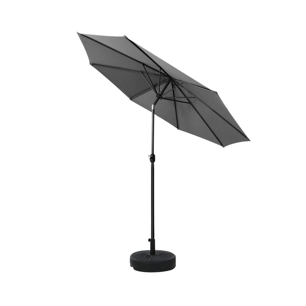 Charcoal outdoor umbrella with open canopy and central pole with weighted base