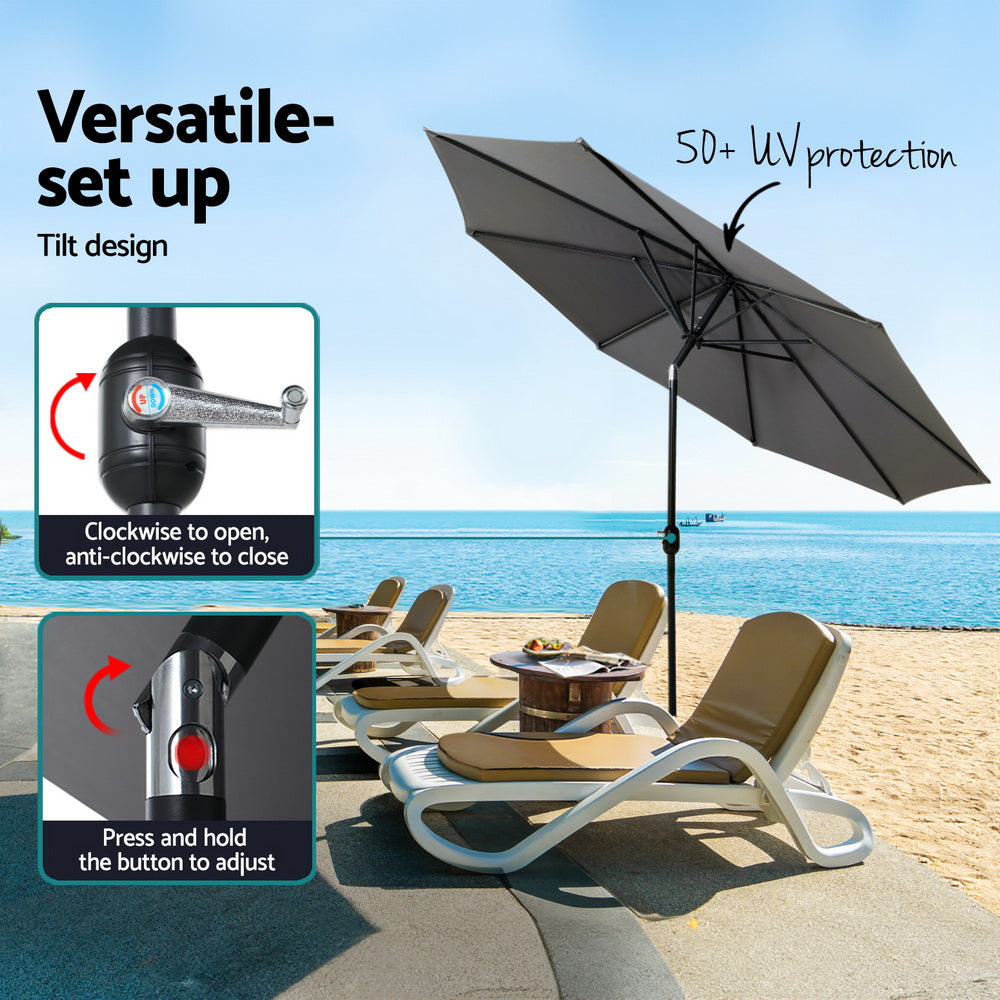 Charcoal patio umbrella with tilt crank control and open canopy on weighted base