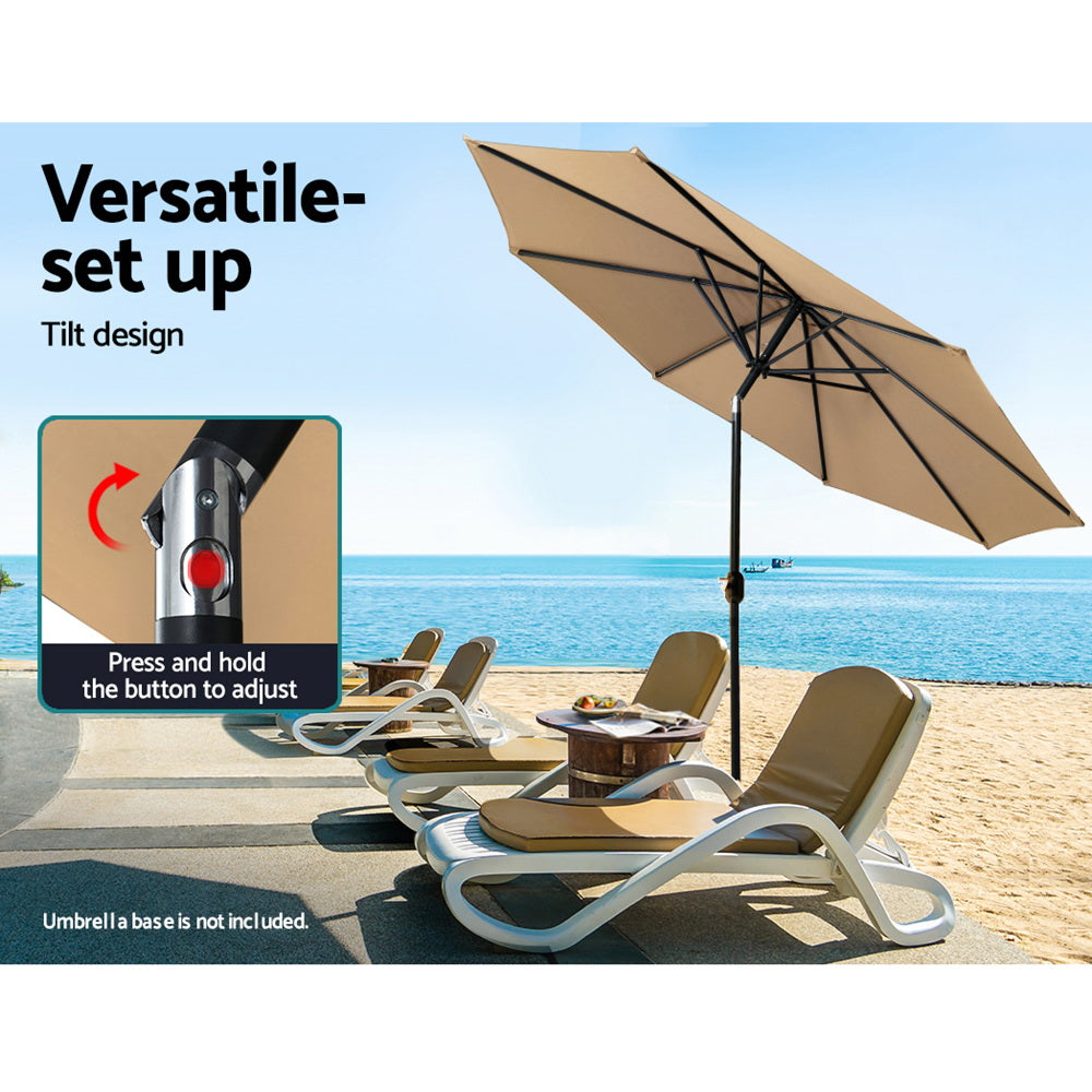 Outdoor umbrella with beige canopy and adjustable black center pole