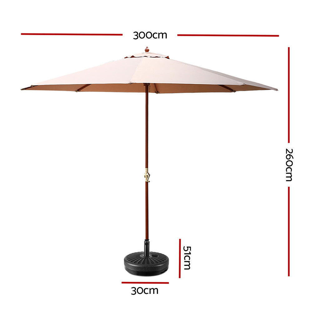 Beige patio umbrella with wooden central pole and round black base