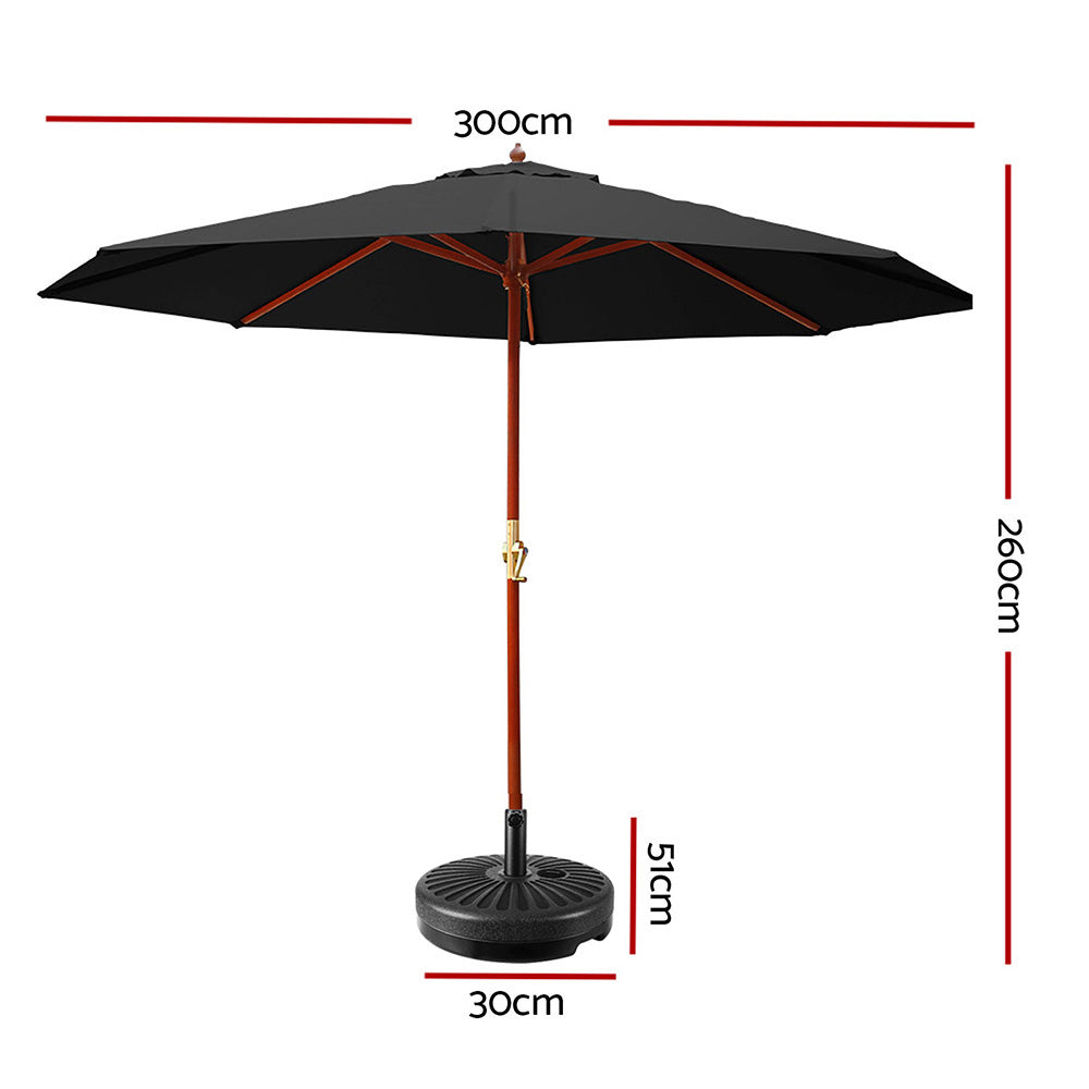Black outdoor patio umbrella with orange pole and round weighted base