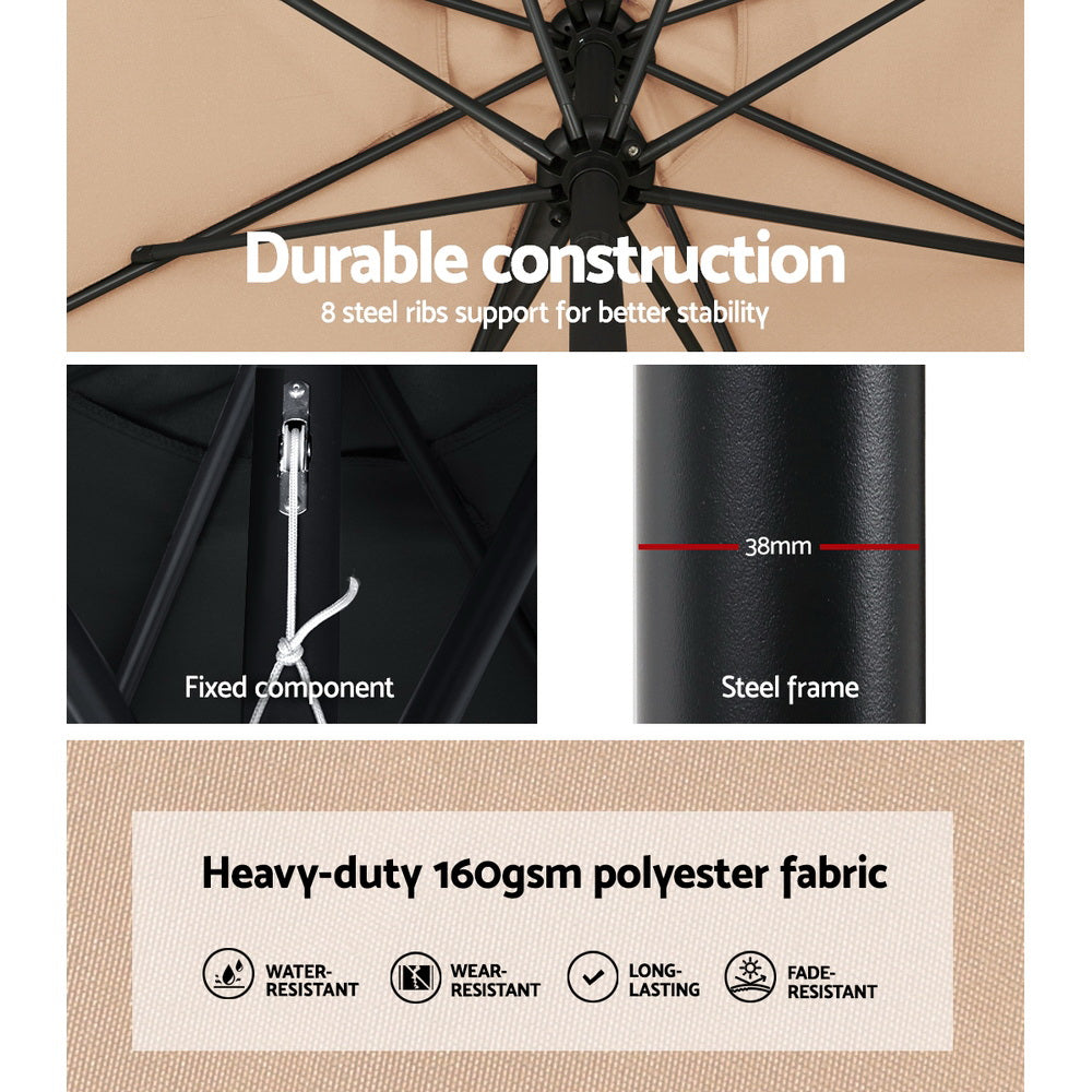 Beige umbrella canopy with black ribs and center hub