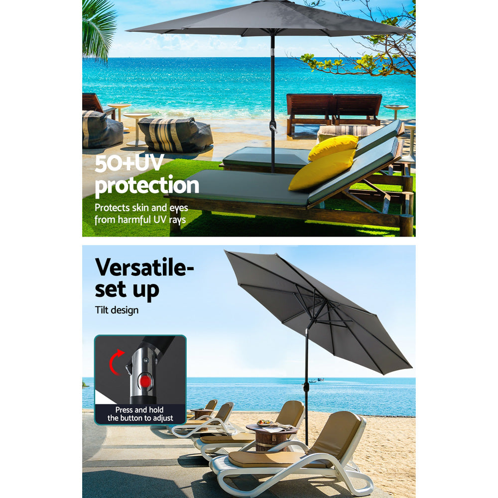 Charcoal outdoor umbrella shading patio chairs, with open canopy providing shade