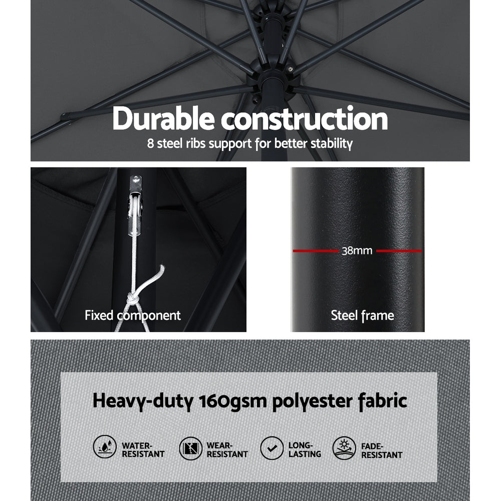 Outdoor umbrella frame with steel pole and dark canopy ribs under construction