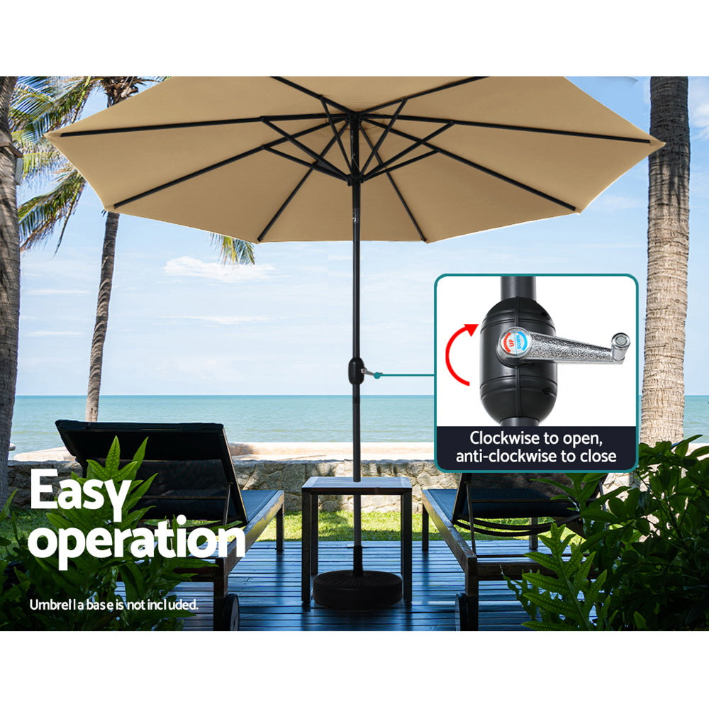 Beige outdoor patio umbrella with tilted open canopy and black pole