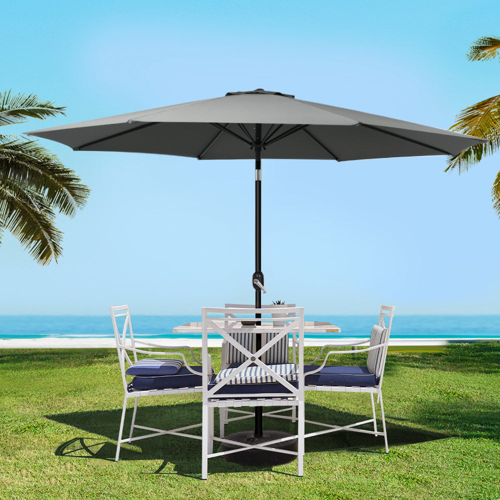 Charcoal outdoor umbrella with wide tilted canopy and central pole