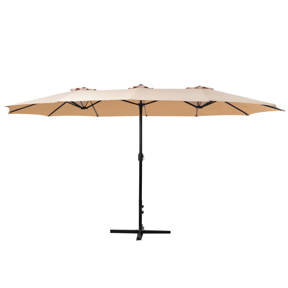 Beige outdoor umbrella with black center pole and open canopy
