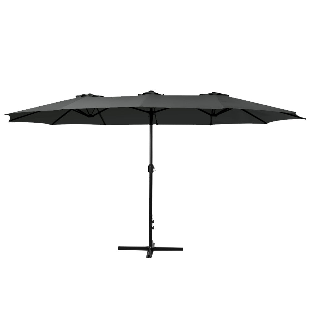 Black outdoor umbrella with open canopy, center pole, and cross base for stability.