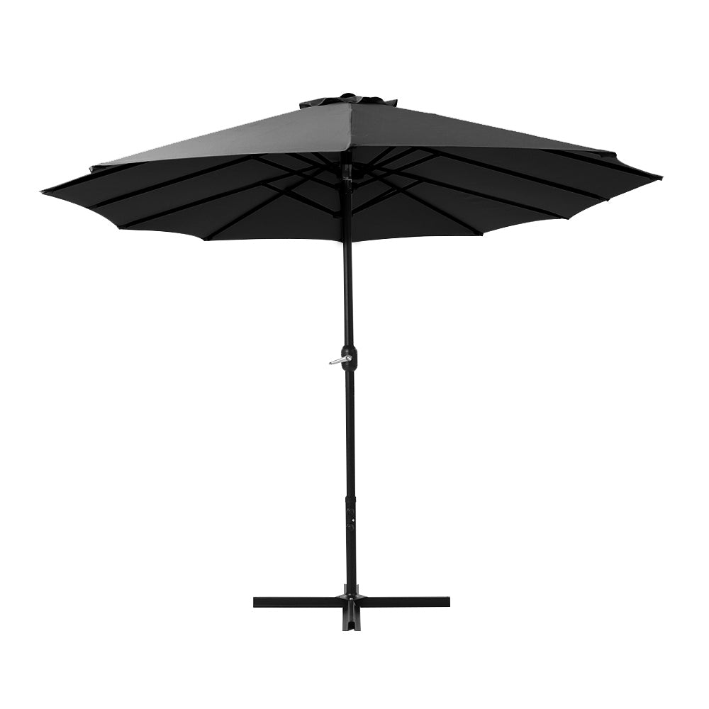 Black outdoor umbrella with open canopy and visible rib framework on the center pole.