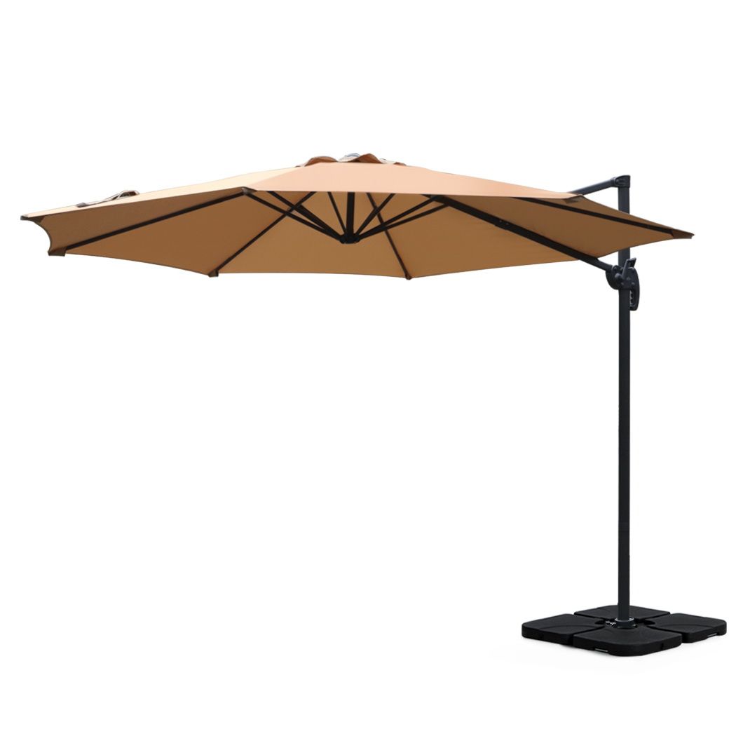 Beige cantilever patio umbrella with open canopy and black side pole, square base