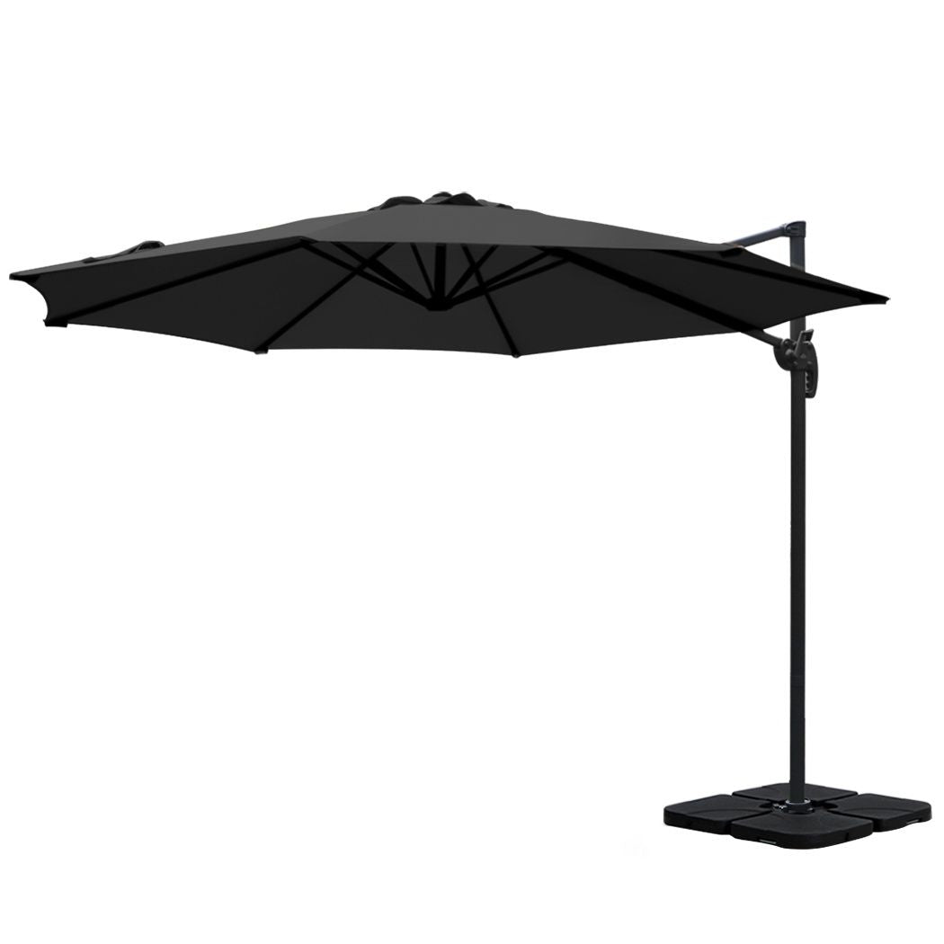 Black cantilever patio umbrella with open canopy on side-support pole and square base
